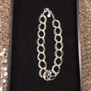 Silver colored necklace with adjustable clasp